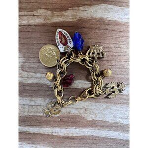 Vintage Coro Gold-Tone Charm Bracelet With Religious & Musical Motifs Red & Blue